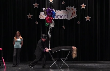 Magic Dave performing at a private indoor party or banquet