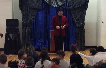 Magic Dave performing at a school assembly in Illinois or Wisconsin